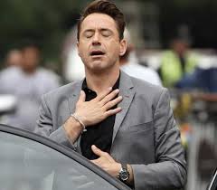 Robert Downey Jr. w/ eyes closed and hand to his chest