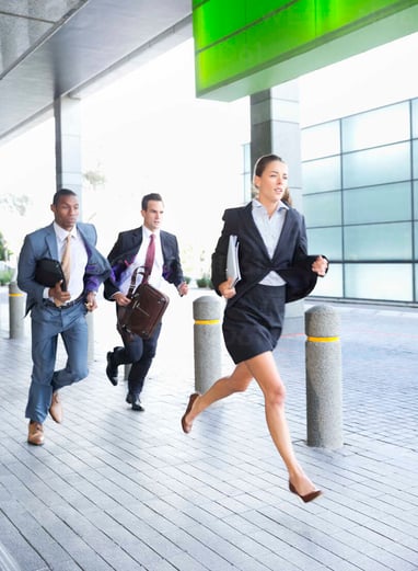 1 business woman and 2 business men running in suits