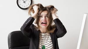 woman pulling on her hair in frustration