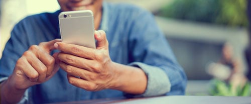 close-up-hand-hold-mobile-cell-phone-device